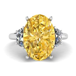 Ring mit ovalem gelbem Diamant und seitlichem Halbmond aus weißen Diamanten aus Weißgold