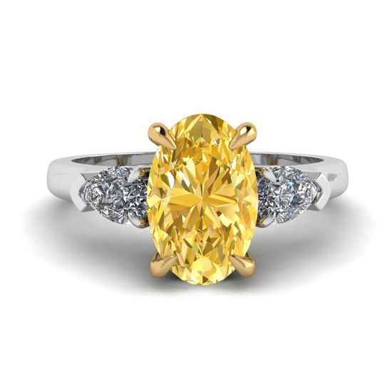 Ovaler Ring mit gelbem Diamant und seitlichem, birnenförmigem, weißem Diamantring, Bild vergrößern 1